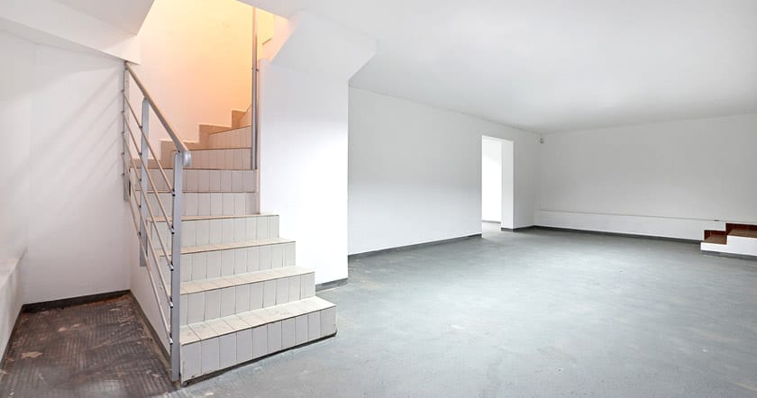 empty basement with stairwell
