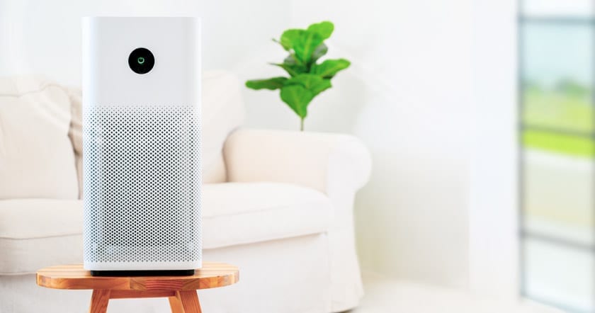 white ionizer air purifier in clean cozy white living room