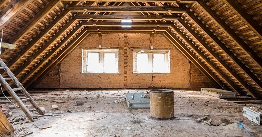 unfinished attic with wood beams
