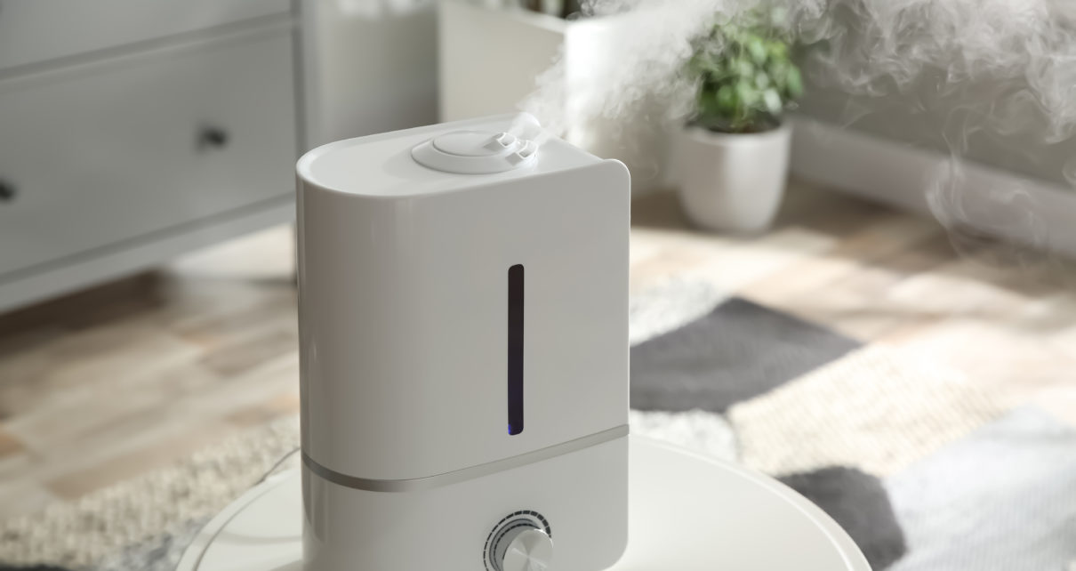 modern white air purifier with silver control knob