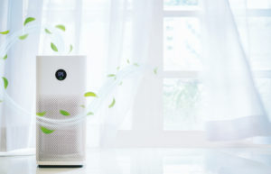 Air Purifier with Gust of Clean Air and Fresh Leaves Blowing for Purpose of Finding Out Do Air Purifiers Dry the Air